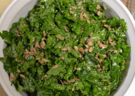 raw kale salad with balsamic, pine nuts, and parmesan