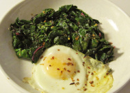eggs nested in sautéed chard and mushrooms
